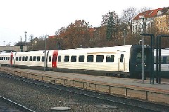Ic3 trainset photographed at the railway station in Aarhus 20. December 2003.  The Ic3 was built by ABB Scandia in Denmark. Each unit consists of 3 coaches. Built in a number of 92 trainsets. The trainsets were put in service in 1989 - 1998. 4 diesel engines of 294 kW per trainset. Max speed 180 km/h - 112 mph. Length 58 800 mm. Weight 97 metric tonnes. 16 seats 1st class, 128 seats 2nd class. Up to 5 trainsets can be put together.